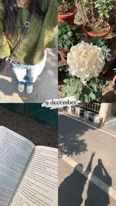 a woman standing next to a book with flowers in it