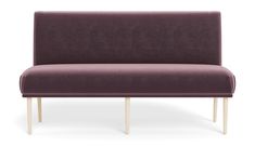 an upholstered couch with wooden legs and a dark purple fabric cover on the back