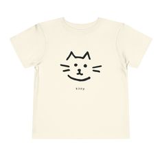 Introduce a touch of sweetness with this cute kitty shirt for your adorable little trendsetters who appreciate a sprinkle of style! ** 100% Airlume combed and ringspun cotton (fiber content may vary for different colors) ** Extra light fabric (3.9 oz/yd² (132 g/m ** Tear-away label ** Slight variances in color and size are normal compared to what you see on a computer screen, however if you have any concerns please don't hesitate to reach out to us via email. Coupon code (15OFF) for 2 or more on Cute Organic Cotton T-shirt For Everyday, Playful Cotton T-shirt With Cat Design, Playful Cotton Cat Print T-shirt, Playful Cotton T-shirt With Cat Print, Playful Short Sleeve T-shirt With Cat Design, Cute Kitty, Cat Lover Gift, Cat Shirt, Cat Shirts