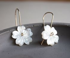 "Beautiful and elegant flower earrings. Perfect bridal pair of earrings. These earrings feature hand-carved white mother of pearl shell, creating sweet flowers. These flowers then made into small threader earrings in your choice of metal: sterling silver, 14k gold-filled, or rose gold filled. These pair of earrings are a perfect everyday piece of jewelry that is also perfect for any special occasion. Earrings measure at 1 1/2\" long 3,5 cm Flowers are 20 mm long and wide. PACKAGING -Your purchas Delicate White Pearl Pierced Earrings, Dainty White Pierced Flower Earrings, Elegant White Flower Pendant Earrings, Wedding Flower Earrings In Mother Of Pearl, Handmade White Flower Pearl Earrings, Delicate Nickel-free White Earrings, Delicate White Nickel-free Earrings, White Mother Of Pearl Flower Earrings, White Flower Earrings With Ear Wire For Anniversary