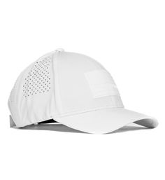 a white baseball cap with perfored details on the front and side panels,