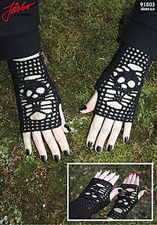 a pair of black gloves with skulls on them and one hand in the shape of a skull