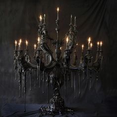 an elaborate chandelier with many lit candles