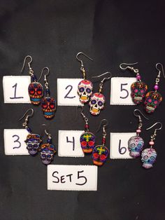 HANDMADE SUGAR SUGAR EARRINGS set 5 --choose from #1-6 and that exact one you will receive :) If you would like many please message us :) DETAIL IS AMAZING! NOT ONE IS THE SAME! COOLER IN PERSON! Set 5 Bohemian Skull Earrings For Gifts, Multicolor Halloween Earrings For Gift, Multicolor Halloween Earrings Gift, Handmade Earrings For Day Of The Dead, Handmade Skull Earrings For Halloween, Halloween Skull Print Earrings Gift, Handmade Skull Earrings For Day Of The Dead, Bohemian Halloween Earrings As Gift, Bohemian Earrings For Halloween Gift