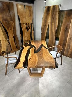 a table made out of wood sitting on top of a tile floor next to chairs