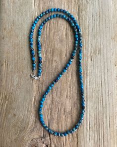 Blue Sea Sediment Jasper Bead Necklace https://kathybankston.com/products/blue-sea-sediment-jasper-bead-necklace-strand-small-4mm-blue-stone-beaded-necklace #jasper #necklace #summerfashion #beachy #beaded #handmade Blue Oval Beads Single Strand, Blue Single Strand Oval Beads, Blue Oval Single Strand Beads, Blue Single Strand Necklace With Oval Beads, Blue Polished Beaded Bracelets For Healing, Turquoise Lapis Lazuli Beaded Necklace With Polished Beads, Blue Turquoise Necklace For Healing, Turquoise Lapis Lazuli Beaded Necklace With Round Beads, Turquoise Lapis Lazuli Beaded Necklace