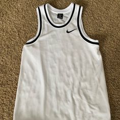 Size Small, Never Worn! White Nike Jersey. Nike White Tops For Summer, White Classic Crew Neck Tank Top, White Nike Tops For Spring, White Casual Nike Tank Top, Casual White Nike Tank Top, Nike Classic Fitted Tops, Classic White Nike Tops, Classic Fitted Nike Tops, Classic White Sports Top