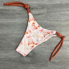 Your quick trip to the beach shouldn't be a struggle. These bottoms are adjustable and cheeky, giving you the perfect fit so you can throw on your favorite top and head out the door. The cute Jeep print and "Mermaid off Duty" design makes this bottom irresistible!Matching Sierra NV Top HEREMatching Triangle Top HEREMatching Scrunchie HERE Printed Tie-side Beachwear Bottoms, Playful Printed Swimming Bottoms, Adjustable Swimwear For Surfing And Beach Season, Adjustable Swimwear For Surfing During Beach Season, Beach Season Tie-side Bottoms, Playful Bottoms For Surfing Beach Season, Playful Bottoms For Surfing And Beach Season, Playful Bottoms For Surfing At Beach Season, Beachy Printed Tie-side Swimwear