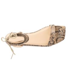 Meet the Zelia, your ultimate statement in edgy wrap sandals. Designed for those who dare to stand out, these strappy flats boast a wide width for all day comfort. With a contemporary snakeskin print, they offer versatility and a bold aesthetic that commands attention. Whether paired with jeans or a flowing dress, the Zelia ensures you're ready to step into any occasion with confidence and style, making them a must have for fashion forward individuals. Adjustable Ankle Tie Sandals With Heel Strap, Trendy Adjustable Ankle Wrap Sandals, Chic Adjustable Flats With Flat Heel, Spring Ankle Wrap Sandals With Adjustable Strap, Chic Adjustable Flats, Trendy Sandals With Heel Strap And Ankle Tie, Adjustable Flat Lace-up Sandals With Removable Insole, Mens Flip Flops Beach, Chic Snake Print Heels