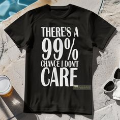 New! For Men Or Women. There's A 99% Chance I Don't Care Graphic T-Shirt In Black. Mens/Unisex Cut And Sizing For Comfortable Fit. 100% Cotton. Crew Neck. Short Sleeves. Black Color Tee With White Design. Tags # Mens Womens Teens Urban Outfit Casual Classic Unique Custom Bold Cool Handmade Dark Funny Sayings Phrase Rude Humor Gift For Him Her New To Poshmark? Save $10 On Your First Purchase When You Sign Up For An Account With The Invite Code: Freshfit Funny Black T-shirt With Graphic Print, Trendy Short Sleeve T-shirt With Funny Text, Black Themed T-shirt With Funny Print, Edgy T-shirt With Funny Print And Short Sleeves, Black Short Sleeve T-shirt With Funny Print, Rude T Shirts, Black Graphic Tees, Customise T Shirt, I Don't Care