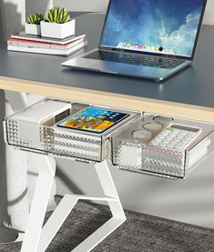 an open laptop computer sitting on top of a desk next to a drawer with drawers