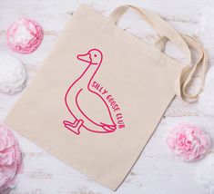 Looking for a hilarious gift that also comes in handy? Look no further than the Silly Goose Tote Bag! Crafted from lightweight canvas, this quirky accessory showcases a funny design that is guaranteed to brighten your day. Whether you use it for grocery shopping, beach trips, or as a statement piece, this versatile bag is sure to turn heads and elicit plenty of laughs. Pink Novelty Bags For Everyday Use, Pink Novelty Bag For Everyday Use, Novelty Rectangular Everyday Bag, Novelty Rectangular Bags For Everyday, Novelty Rectangular Bag For Everyday Use, Goose Bag, Funny Tote Bags, Best Tote Bags, Stylish Tote Bag