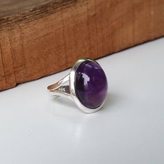 Amethyst ring, Sterling Silver ring, cocktail ring, alternative engagement ring, Amethyst jewelry, Valentine's day jewelry, silver jewellery Description: Be assured that the product you order is MADE JUST FOR YOU and is not a mass produced item. The gemstone is a oval shaped AMETHYST GEM SIZE- 12*16mm The rest of the ring is made from 925 STERLING SILVER i.e 92.5% pure silver. And it DOESN'T HAVE ANY LEAD OR NICKEL. FOR A COMPLETE LOOK DO CHECK THEM: https://www.etsy.com/listing/645670663/natura Amethyst Open Ring Fine Jewelry, Sterling Silver Gemstone Rings For Formal Occasions, Amethyst Solitaire Crystal Ring In Fine Jewelry Style, Silver Solitaire Ring Gemstone, Adjustable Gemstone Signet Ring, Fine Jewelry Amethyst Ring With Open Design, Formal Sterling Silver Gemstone Rings, Amethyst Gemstone Birthstone Open Ring, Amethyst Open Ring Birthstone