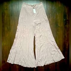 Nwt Boutique Flawless Wide Leg Pink Palazzo Pants Women’s Dress Pants Medium M New With Tags! Popular Boutique Brand Flawless Size: Medium Wide Flowy Legs Pockets At The Hips Pretty Blush Pink Color Elastic Waist For A Perfect Fit! Lining Around The Top So That You Can’t See Through Them Flare Bottoms In Solid Color For Summer, Solid Flare Bottoms For Summer, Flared Solid Bottoms For Summer, Summer Solid Color Flare Bottoms, Non-stretch Flare Bottoms For Summer, High Waist Rayon Wide Leg Pants For Summer, Stretch Flare Bottoms For Summer, Fitted Wide-leg Summer Culottes, Fitted Casual Rayon Pants