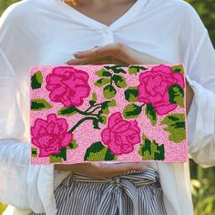 "Our pink & green summer floral clutch is the perfect clutch purse bag for summer that features a floral beaded front with white canvas lining and backing and is finished with silver hardware and a silver chain to wear as a crossbody purse.    * crossbody purse/ clutch/ bag  * beaded front w/ canvas backing  * sizing 10\"x6.5\" Shop Saints Headbands  https://www.etsy.com/shop/saintsheadbands" Spring Clutch Evening Bag As Gift, Spring Clutch Evening Bag, Spring Clutch Evening Bag For Gift, Embroidered Clutch For Summer Gift, Embroidered Clutch As Summer Gift, Embroidered Clutch Gift For Summer, Spring Party Beaded Clutch, Pink Pouch Clutch For Summer, Pink Summer Clutch As A Gift