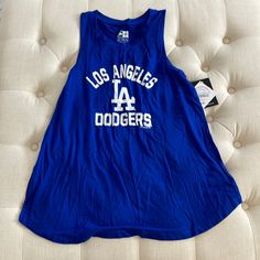 Dodger Tank Top Trendy Blue Tank Top For Streetwear, Summer Game Day Tank Top, Blue Graphic Print Tank Top For Spring, Blue Sleeveless Sports Season Tops, Summer Blue Streetwear Tank Top, Blue Tank Top For Summer Streetwear, Spring Blue Graphic Print Tank Top, Blue Sleeveless Top For Sports Season, Blue Graphic Print Sporty Tank Top