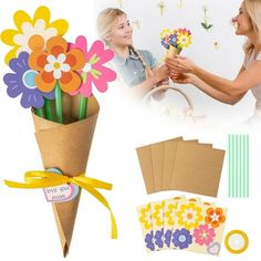 two women holding flowers and greeting each other with cards, envelopes and stickers