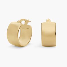 An instantly iconic addition to your ear stack, these lobe-hugging 14k yellow gold hoops are designed with a sleek low profile curve that leaves a bold impression on its own or effortlessly paired with your go-to studs. Minimalist 14k Gold Huggie Earrings With Shiny Finish, Formal Minimalist Oval Huggie Earrings, Minimalist Shiny Huggie Earrings For Formal Occasions, Formal Minimalist Huggie Earrings With Shiny Finish, Minimalist Polished Finish Huggie Earrings For Formal, Minimalist Polished Yellow Gold Huggie Earrings, Modern Oval Huggie Earrings For Formal Occasions, Modern 14k Gold Huggie Earrings, Modern Yellow Gold Huggie Earrings For Everyday