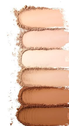 four different shades of makeup on a white background, with one light brown and the other dark