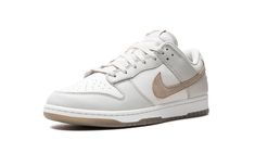 The Nike Dunk Low SE “Phantom/Khaki” is a colorway of the retro basketball shoe with a clean and easy-wearing design.  The upper is complete with a white leather base and Phantom-colored leather overlays.  A hairy suede Khaki Swoosh can be found on the sides, while “Nike” branding is embroidered on the heel.  A “Nike” and Swoosh logo also appear on the tongue tag.  Underfoot, a white rubber midsole and Khaki rubber outsole completes the look.  Release date: April 2, 2024 Jordan Golf, Nike X Travis Scott, Nike Branding, Retro Basketball Shoes, Retro Basketball, Jordans Women, Dunks Nike, Kids Converse, Nike Brand