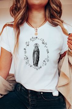 Our Lady of Lourdes T shirt  Catholic t shirts  Religious tees  Catholic gifts  Sacred Hearts Easy 30 day return policy Catholic Outfits, Catholic T Shirts, Catholic Tshirts, Sublimacion Ideas, Sacred Hearts, Mexican Outfit, Lady Of Lourdes, Our Lady Of Lourdes, Our Lady Of Guadalupe