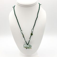 This is a high grade jadeite jade pendant necklace. It is exquisitely hand carved, so each pendant is different in some way. The pendant is completely natural jade, un-dyed and in its natural form. The pendant is carved in the form of the Chinese Zodiac - Ox. The necklace is adjustable - one size fits all. It comes with a gift box. The item is hand carved and natural so it may have imperfections because of the nature of stone or the carving - part of the charm of carved jade! Pictures are of the Jade Amulet Pendant Necklace, Handmade Jade Necklaces For Good Luck, Adjustable Jade Pendant Necklace, Adjustable Jade Necklace, Adjustable Green Carved Necklace, Adjustable Green Carved Necklaces, Adjustable Jade Necklace For Good Luck, Carved Jade Pendant Necklace, Carved Jade Pendant Jewelry