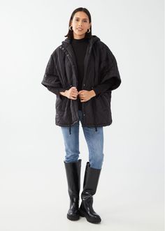 Step out in timeless elegance with our Black Diamond Quilted Poncho. This sophisticated piece features an adjustable drawstring at the waist for a more tailored fit, elbow-length sleeves for a chic silhouette, and a closed hood that adds a touch of mystery. Black Quilted Nylon Adjustable Drawstring Waist Elbow-length Sleeves Hand wash cold, hang dry. Back Length: 30" Model is wearing size XS-S-M. Quilted Poncho, Black Quilt, Diamond Quilt, Elbow Length Sleeve, Black Diamond, Drawstring Waist, Timeless Elegance, Hand Wash, How To Wear