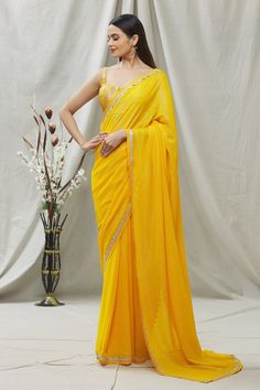 Dandelion yellow self woven saree in gold and silver alternate metallic threads. Paired with silk brocade blouse with matt zari work. Component: 2 Pattern: Embroidered Type Of Work: Zari work, Lace work Neckline: Square Sleeve Type: Sleeveless Fabric: Silk georgette Color: Yellow Other Details:  Lace work saree border Occasion: Sangeet - Aza Fashions Dress Saree, Dandelion Yellow, Brocade Blouse, Eternal Beauty, Brocade Blouses, Yellow Saree, Traditional Indian Outfits, Saree Border, Dream Dresses