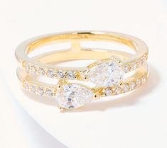 three pieces of gold ring with diamonds on white surface, close up view from the front