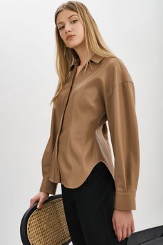 Indulge your fashion sensibilities with the irresistible allure of the Skylar Faux Leather Shirt. Designed to captivate, this statement piece boasts an hourglass silhouette & tapered waist. Faux Leather Shirt, Hourglass Silhouette, Leather Shirt, Shirt Collar, Mocha, Faux Leather, Collar, Leather