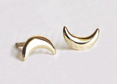 GOLD MOON EARRINGS, GOLD CRESCENT EARRINGS Surprise a special lady in your life with these beautiful crescent moon earrings. With the sophistication of the gold and the style of the design, this pair will gracefully exalt the beauty of the woman you hold dear. READY TO SHIP in 14k white gold (pair) DETAILS Band   Style: Stud  Material: 14k Gold: yellow, white, rose18k Gold: yellow, white, roseOther Metal: platinum  Sizing: We are using US metric system  Customization Options This design can be m Moon Earrings Gold, Gold Moon Earrings, Diamond Earrings Wedding, Moon Stud Earrings, Mom Earrings, Crescent Earrings, Crescent Moon Earrings, Moon Studs, Buy Earrings