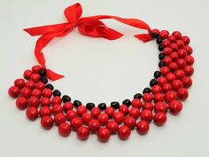 Beautiful wooden necklace. A wonderful accessory for the bride or bridesmaids or girls. Made of high quality materials, The perfect accessory and gift for any woman Handmade Color: red Wooden Beads Necklace Gift, Wooden Beads Round Necklace As Gift, Gift Wooden Beaded Round Necklace, Handmade Red Bib Necklace For Party, Elegant Party Necklace With Wooden Beads, Red Bib Necklace As Gift, Adjustable Red Necklaces For Wedding, Adjustable Red Necklace For Wedding, Red Wooden Bead Necklace As Gift