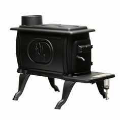 a black stove sitting on top of a metal stand