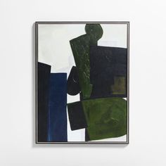 an abstract painting with black, green and blue colors on a white wall in a frame