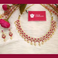 Beautiful American diamond Ruby necklace with earrings. Pearl hangings real ruby set replica. High quality. Perfect for any occasion. More variety on our shop. Feel free to contact us for any enquiries. Please provide detailed address with contact number when order is placed as it is required on shipping label. Elegant Ruby Kundan Necklace With Stone Work, Elegant Chandbali Ruby Jewelry Sets, Formal Ruby Kundan Necklace With Stone Work, Formal Kundan Necklace With Ruby Stone Work, Hand Set Ruby Jewelry Sets For Anniversary, Ruby Jewelry Sets For Celebration, Elegant Ruby Temple Necklace With Gemstones, Elegant Ruby Gemstone Temple Necklace, Elegant Ruby Bridal Necklace With Stone Work