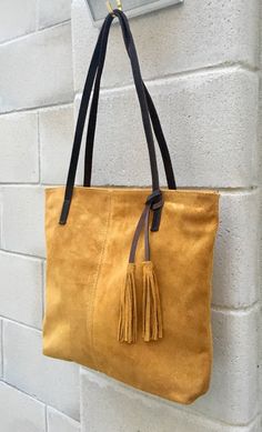 Yellow suede bag. Tote suede leather bag in MUSTARD YELLOW. Natural genuine suede leather. Mustard color large shopper bag. Yellow carry all bag. Mustard yellow suede bag. Closed by a zipper, with shoulder straps in contrasting brown leather. You can easily carry your books, laptop or tablet in one nice bag , made of soft suede leather The inside of the bag is fully lined in a cotton/nylon strong black fabric. We added a zipper closed pocket aswell. You can easily carry your books, laptop or tab Suede Bag With Double Handle And Suede Lining, Suede Double Handle Bag With Suede Lining, Double Handle Suede Bag With Suede Lining, Suede Shopping Bag With Suede Lining, Suede Double Handle Bag With Soft Leather, Soft Suede Bags With Double Handle, Soft Suede Bag With Double Handle, Suede Shoulder Bag With Suede Lining For Shopping, Double Handle Suede Bag In Soft Leather