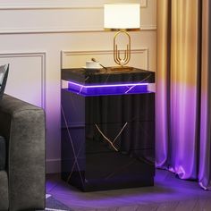 a black table with a purple light on top