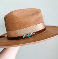 This gorgeous leather and turquoise hat band is a stunning mix of Art Deco vibes with its clean vertical lines and a little bit of the West with bold blue turquoise. It is perfect for layering over taller hat bands, but still makes a statement on its own. It measures 61", is adjustable to fit any hat, and features a small sterling silver slide on the back to tighten the band securely around your hat. Available in your choice of black or brown leather. Designed and handcrafted by Adrienne in Texa Cowboy Hat Bands Liquor, Turquoise Adjustable Fedora With Curved Brim, Adjustable Turquoise Fedora With Curved Brim, Adjustable Turquoise Fedora Hat, Adjustable Wide Brim Turquoise Fedora, Adjustable Turquoise Fedora, Turquoise Western Fedora With Flat Brim, Leather Silver Jewelry, Turquoise Hat