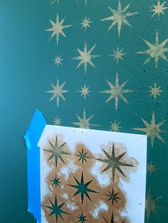 a piece of paper that has been cut out to look like stars on the wall