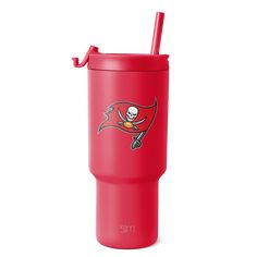 the tampa football team logo is shown on this red tumbler with a straw in it