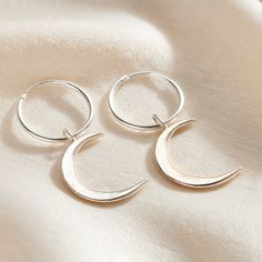 These lunar-inspired Crescent Moon Charm Hoop Earrings add a touch of celestial beauty suitable for both everyday and occasional wear. The crescent shapes evoke mystical and romantic associations often linked with the moon, such as cycles, intuition, and feminine energy. Handmade by our jewellers in Sterling Silver. We make our jewellery using the finest quality 925 Sterling Silver. Minimalist Crescent Hoop Earrings, Crescent Hoop Earrings With Ear Wire, Adjustable Moon Charm Earrings, Celestial Style Hoop Earrings For Everyday Wear, Bohemian Crescent Hoop Earrings With Moon Charm, Bohemian Hoop Earrings With Moon Charm, Metal Moon-shaped Hoop Earrings, Adjustable Moon-shaped Minimalist Earrings, Nickel-free Crescent Hoop Earrings For Everyday