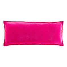 a bright pink velvet pillow on a white background