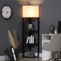 a room with a desk, bookshelf and clock on the wall next to it