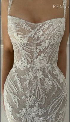 the back of a woman's dress with flowers on it