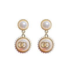 Look elegant and glamorous with these Graceful Glamour Pearl Earrings! These earrings put the “glam” in glamourous! Shine bright with these exquisite earrings and get ready to be the belle of the ball! These earrings feature pearl studs, gold detailing, small pearls circling larger pearl dangles, and a secure post backing. • Earrings measure 2" in length and 1" in width Chic Gold Clip-on Earrings With Pearl Drop, Glamorous Pearl Earrings For Party, Elegant Pearl White Metal Pearl Earrings, Trendy White Pearl Earrings For Formal Occasions, Elegant Rose Gold-plated Pearl Earrings, Elegant Rose Gold Plated Pearl Earrings, Party Pearl Clip-on Earrings, Feminine Pearl Earrings For Evening, Feminine Evening Pearl Earrings