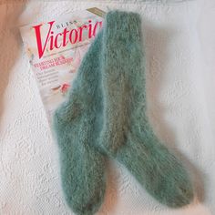 SOFT SAGE GREEN Hand knitted Unisex Mohair Socks Knitted using Classic Elite La Gran Mohair 78% mohair, 12% wool, 10% nylon Beautiful soft Sage green Indoor or Outdoor boot socks, for  Cottage, Fishing, Motorcycle, hiking, walking, skiing, and outdoor activity. Size The sizing on this pair would be Medium Length from cuff to heel 11" From heel to toe 10" If you have any questions please ask. Comfortable Green Winter Socks, Green Winter Socks, Cozy Green Socks For Winter, Comfortable Green Socks As Gift, Comfortable Green Socks For Gift, Comfortable Green Socks For Gifts, Casual Soft Green Socks, Comfortable Super Soft Green Socks, Casual Green Knitted Socks