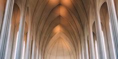 the interior of a large cathedral with many columns