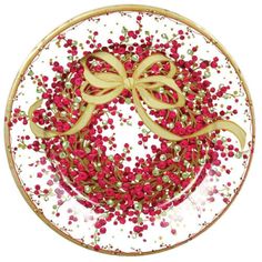 a plate with red and gold sprinkles in the shape of a bow