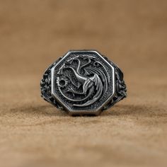 Daenerys Targaryen Dragon Silver Ring, Dragon Fashion Ring, Fantasy Jewelry For Boyfriend, Men Ring with Got Dragon, Anniversary Gift   Made of 925 silver and handcrafted by hand, this ring is not only an accessory piece that complements your daily elegance, but also has details that will reflect your character and style. It is also a great gift to give to your loved ones on their special days. At SavisSilver, we always give importance to the satisfaction of our customers, we recommend you to re Game Of Thrones Ring, Round Ring With Steel Shank For Gift, Round Steel Shank Rings As Gifts, Antique Silver Metal Rings As Gift, Targaryen Ring, Jewelry For Boyfriend, Daenerys Targaryen Dragons, Got Dragon, Dragon Fashion