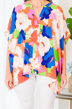 This top truly makes us blush with its beauty! It is the perfect addition to your wardrobe! The floral pattern and flowy fit make it both stylish and comfortable! The bold color mix adds a pop of color to any outfit! Made with high-quality materials for long-lasting wear! 100% Polyester Spring Bold Print Orange Tops, Vibrant Orange Tops For Day Out, Spring Beach Blouse With Abstract Print, Spring Pink Top With Vibrant Print, Pink Vibrant Print Top For Spring, Vibrant Floral Print Blouse For Vacation, Colorful Floral Print Tops For Spring, Orange Vibrant Print Top For Day Out, Summer Orange Tops With Bold Print